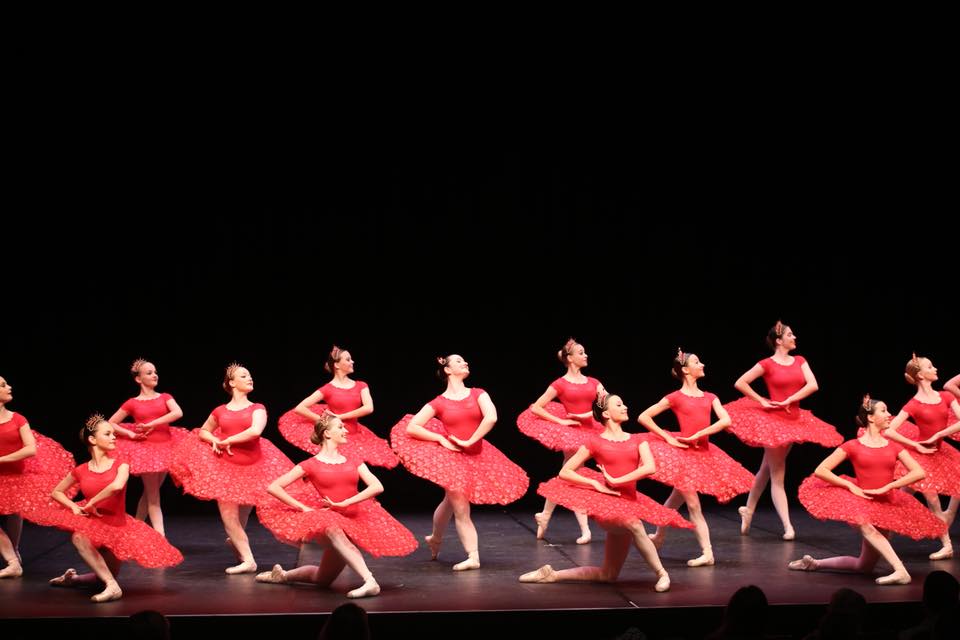 Classical ballet group in red tutus