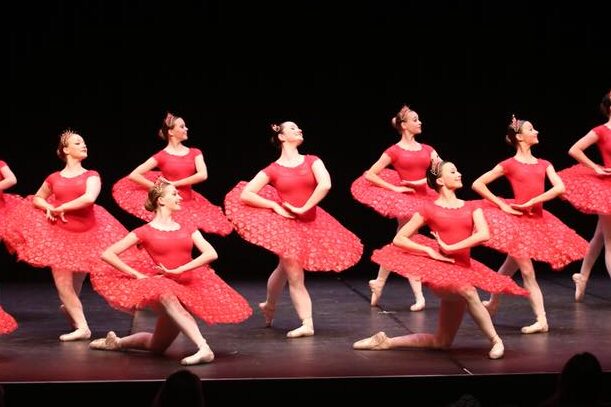 Classical ballet group in red tutus